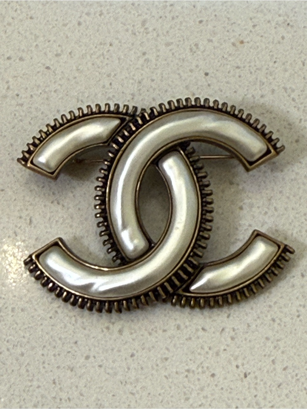 CHANEL CC Brooch with Antique Gold Trim